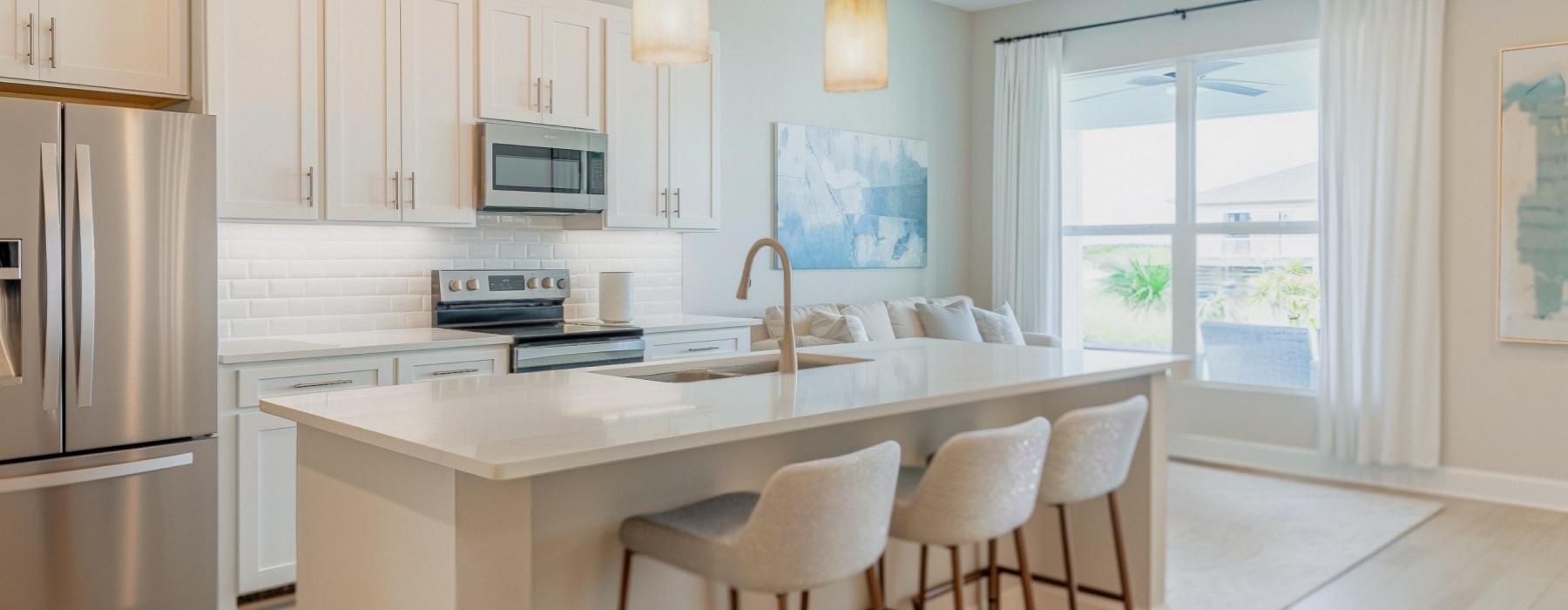 a kitchen with white cabinets