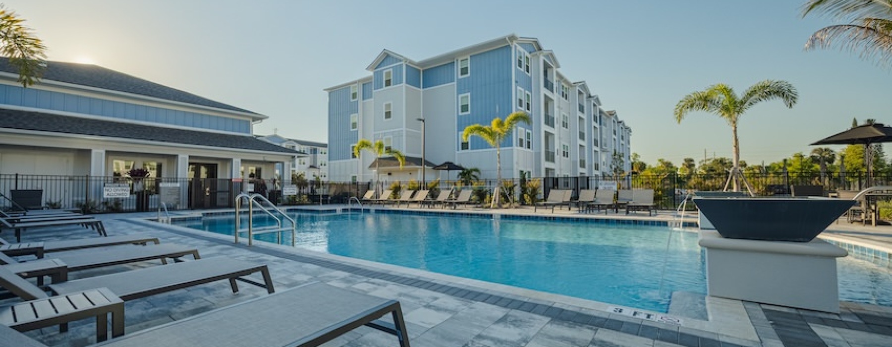 Landscaped outdoor social area at Madison Grove apartments near Space Coast attractions.